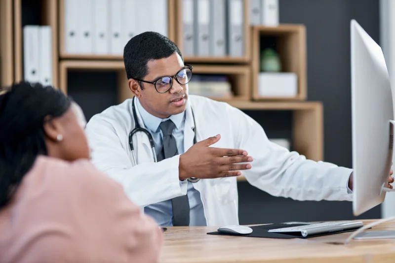 A doctor discussing possible treatment options with a Sjogren’s Syndrome patient